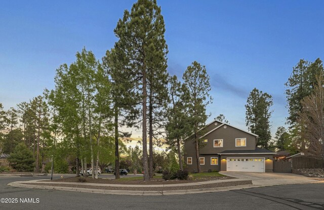 1085 N Conifer Rd, Flagstaff, AZ 86001 - view of front facade featuring driveway and an attached garage