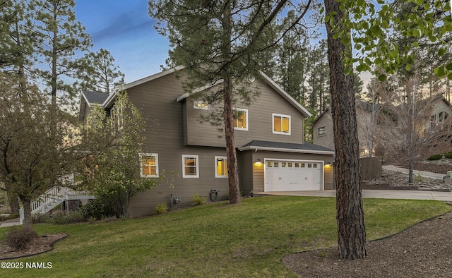 1085 N Conifer Rd, Flagstaff, AZ 86001 - view of front of house featuring an attached garage, concrete driveway, and a front yard