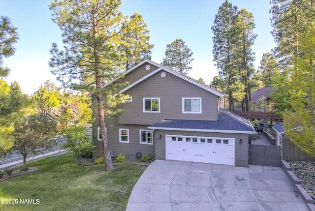 1085 N Conifer Rd, Flagstaff, AZ 86001 - traditional home with driveway, an attached garage, and a shingled roof