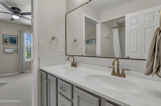 1085 N Conifer Rd, Flagstaff, AZ 86001 - bathroom featuring double vanity, ceiling fan, and baseboards