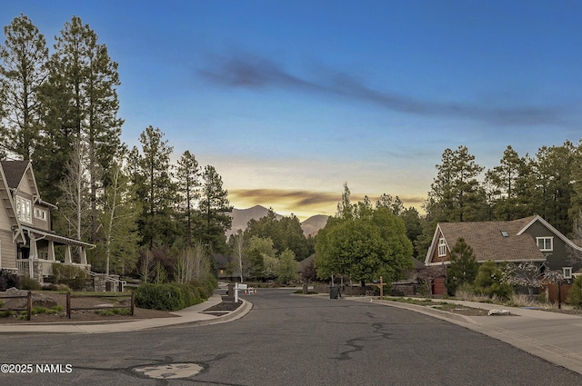 1085 N Conifer Rd, Flagstaff, AZ 86001 - view of asphalt road featuring sidewalks, curbs, and a mountain view