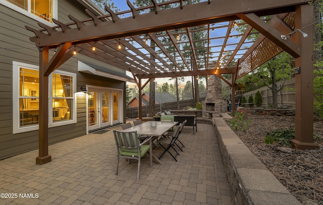 1085 N Conifer Rd, Flagstaff, AZ 86001 - view of patio / terrace featuring an outdoor stone fireplace, a pergola, outdoor dining area, and french doors