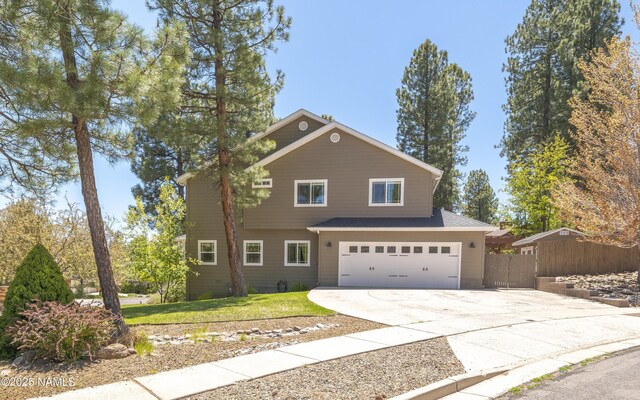 1085 N Conifer Rd, Flagstaff, AZ 86001 - traditional-style house featuring driveway and an attached garage