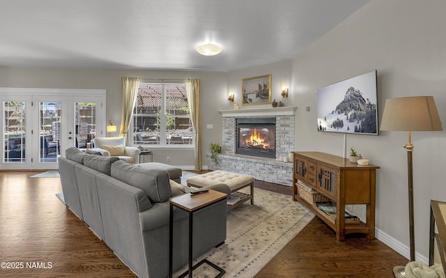 1085 N Conifer Rd, Flagstaff, AZ 86001 - living room featuring a brick fireplace, wood finished floors, baseboards, and french doors