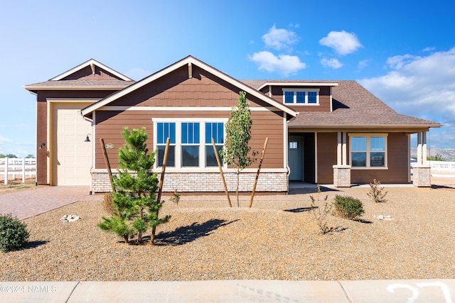 craftsman inspired home with a garage