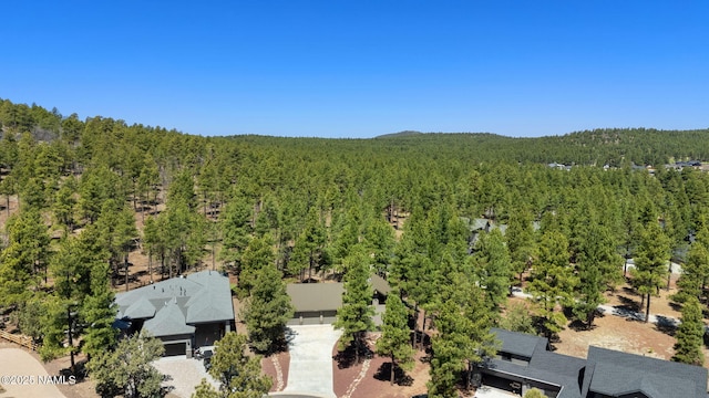 bird's eye view featuring a forest view