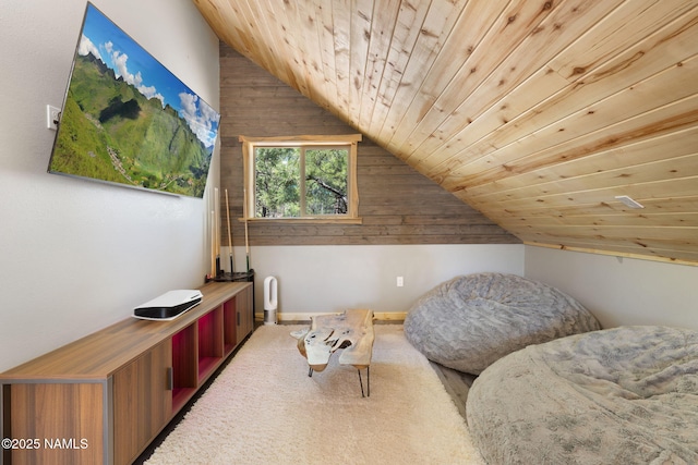 sitting room with wood walls, wood ceiling, vaulted ceiling, and carpet flooring