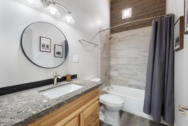 full bathroom with vanity, wood finished floors, shower / bath combination with curtain, and toilet