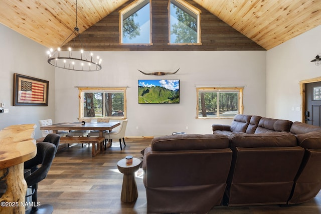 living area featuring wood-type flooring, high vaulted ceiling, a notable chandelier, and wooden ceiling