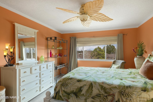 bedroom featuring ceiling fan, a textured ceiling, and crown molding