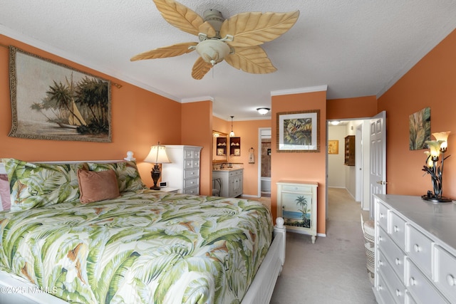 bedroom with a textured ceiling, ensuite bath, light carpet, ceiling fan, and crown molding