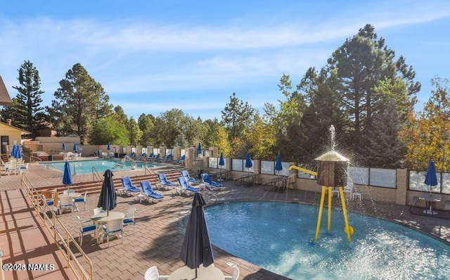 view of swimming pool featuring a patio