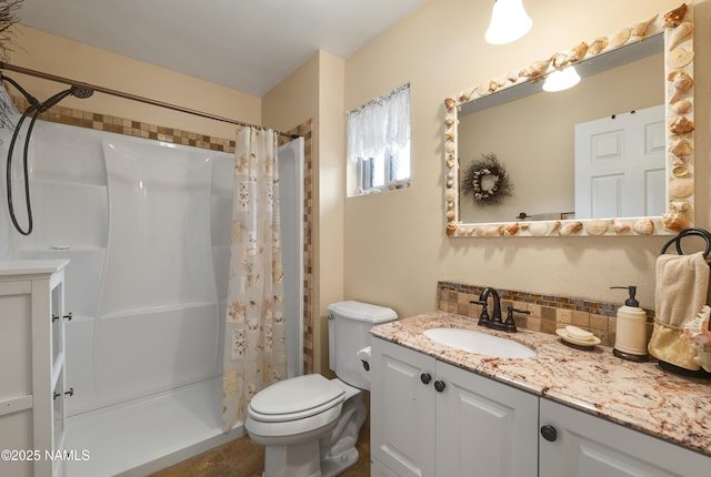 bathroom with toilet, vanity, tile patterned floors, and a shower with shower curtain