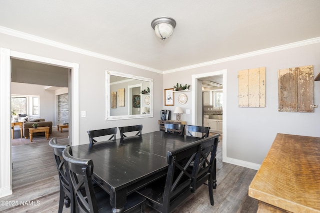 5495 E Crisp Hill Rd, Flagstaff, AZ 86004 - dining area featuring baseboards, ornamental molding, and dark wood-style flooring
