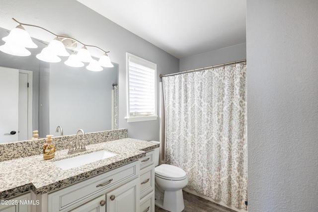 5495 E Crisp Hill Rd, Flagstaff, AZ 86004 - full bathroom with a shower with shower curtain, toilet, vanity, and wood finished floors