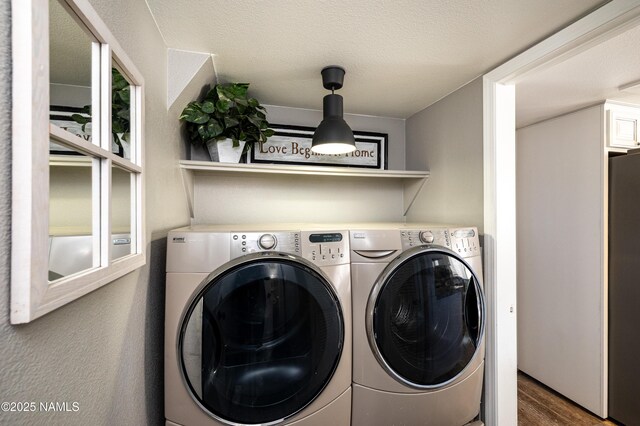 5495 E Crisp Hill Rd, Flagstaff, AZ 86004 - laundry area featuring washer and dryer, laundry area, wood finished floors, and a textured ceiling