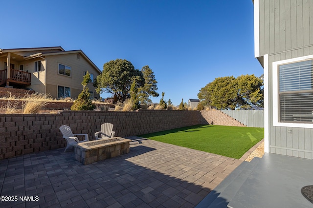 5495 E Crisp Hill Rd, Flagstaff, AZ 86004 - view of patio with a fenced backyard and an outdoor fire pit