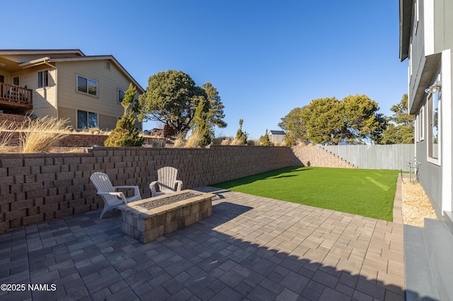 5495 E Crisp Hill Rd, Flagstaff, AZ 86004 - view of patio / terrace with a fire pit and a fenced backyard