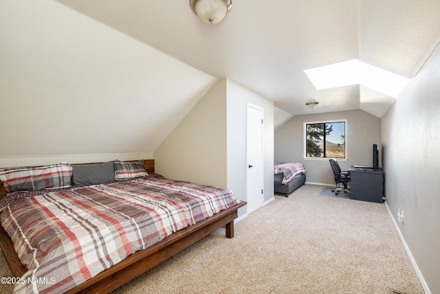 5495 E Crisp Hill Rd, Flagstaff, AZ 86004 - bedroom featuring baseboards, lofted ceiling with skylight, and carpet flooring