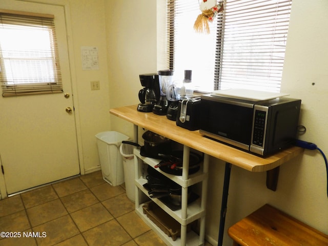 home office featuring tile patterned flooring