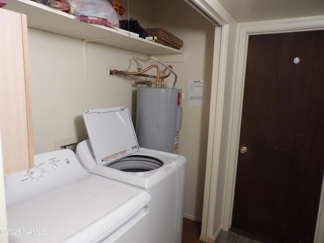 laundry room with washer and dryer, laundry area, and water heater