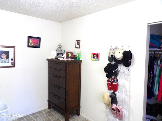 interior space with a textured ceiling