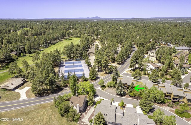 2800 N Saddleback Way Unit 2, Flagstaff, AZ 86004 - drone / aerial view with a residential view, a wooded view, and view of golf course