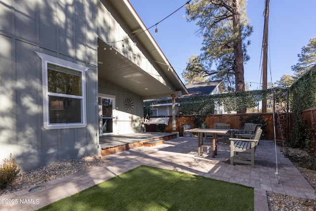 view of yard featuring a patio and a deck