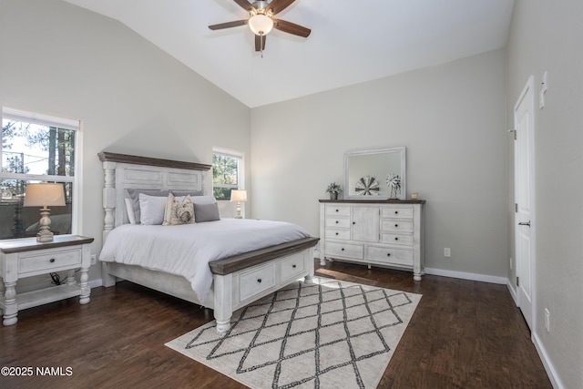 bedroom featuring ceiling fan, multiple windows, dark hardwood / wood-style floors, and lofted ceiling