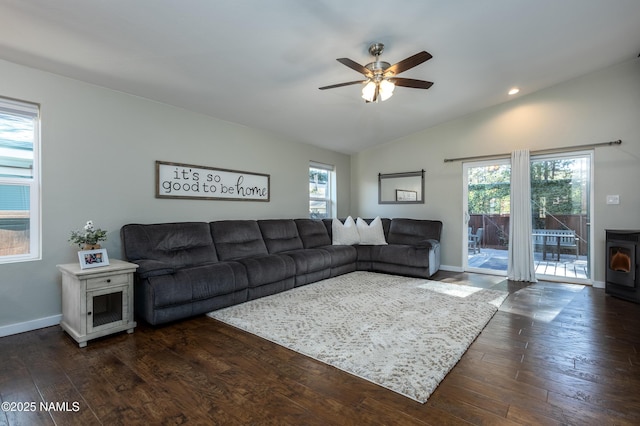 living room featuring ceiling fan, dark hardwood / wood-style flooring, and lofted ceiling