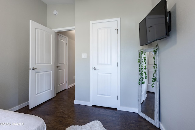 bedroom featuring dark wood-type flooring