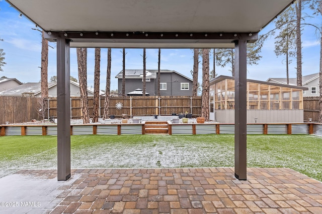 view of patio / terrace with a fenced backyard and a sunroom