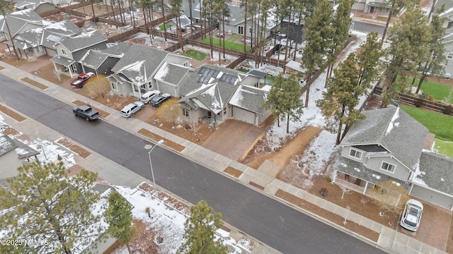 birds eye view of property with a residential view