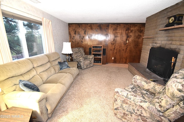 733 S 3rd St, Williams, AZ 86046 - carpeted living room with wooden walls and a fireplace
