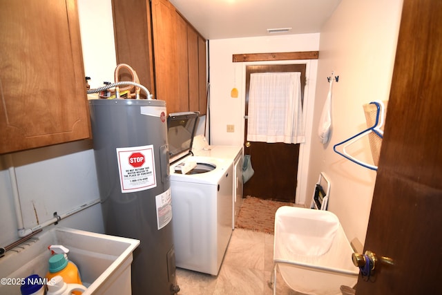 733 S 3rd St, Williams, AZ 86046 - laundry area featuring water heater, cabinet space, light tile patterned flooring, and separate washer and dryer