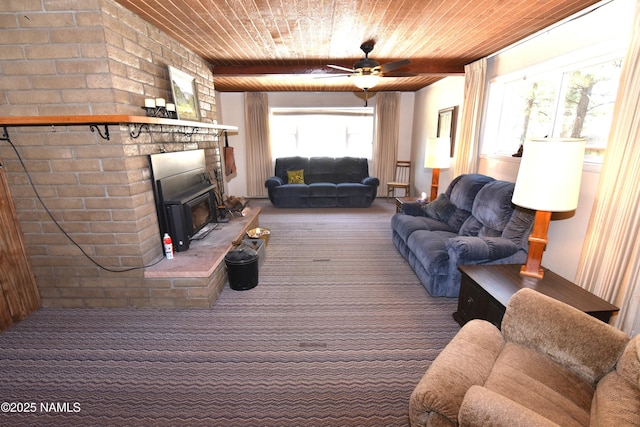 733 S 3rd St, Williams, AZ 86046 - carpeted living room featuring wooden ceiling, plenty of natural light, a ceiling fan, and a fireplace