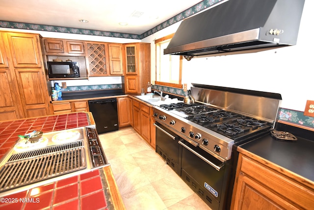 733 S 3rd St, Williams, AZ 86046 - kitchen featuring black appliances, range hood, a sink, brown cabinets, and wallpapered walls