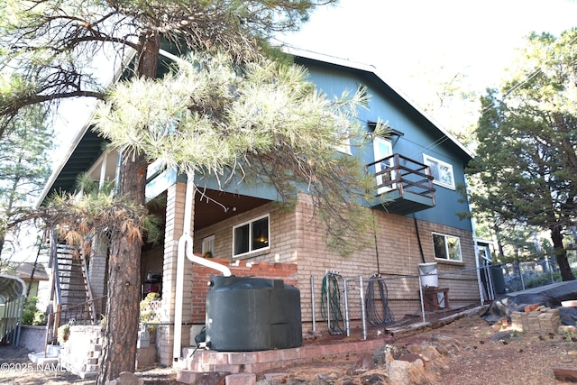 733 S 3rd St, Williams, AZ 86046 - view of side of property featuring a balcony and a carport