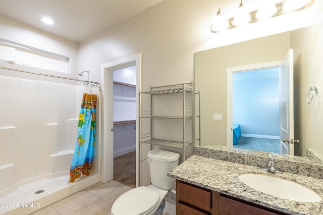 2749 Adirondack Ave, Flagstaff, AZ 86001 - bathroom featuring vanity, toilet, tile patterned floors, and a shower with curtain