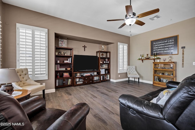 41215 N Lytham Ct, Phoenix, AZ 85086 - living room featuring a ceiling fan, wood finished floors, and baseboards