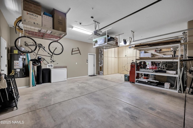 41215 N Lytham Ct, Phoenix, AZ 85086 - garage with a garage door opener, gas water heater, and a workshop area