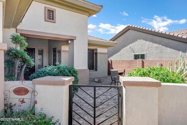 41215 N Lytham Ct, Phoenix, AZ 85086 - doorway to property with a gate and stucco siding
