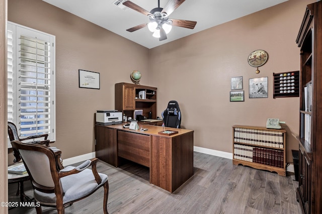 41215 N Lytham Ct, Phoenix, AZ 85086 - home office with ceiling fan, wood finished floors, and baseboards