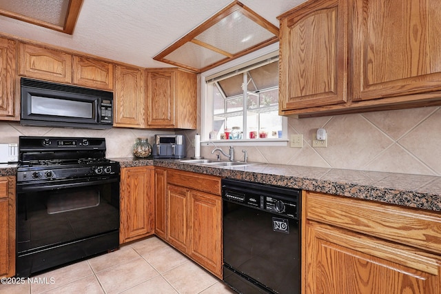 17665 Mustang Rd, Munds Park, AZ 86017 - kitchen with a sink, tile counters, tasteful backsplash, light tile patterned floors, and black appliances
