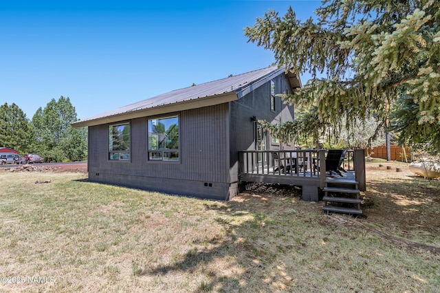 535 Stringer Rd, Munds Park, AZ 86017 - view of side of property with crawl space, a deck, a lawn, and a metal roof