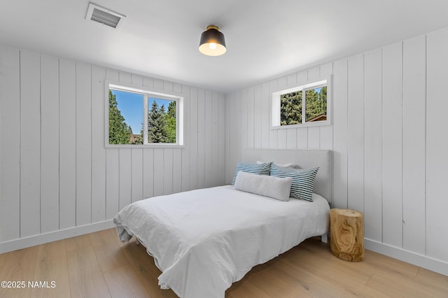 535 Stringer Rd, Munds Park, AZ 86017 - bedroom featuring wood finished floors and multiple windows