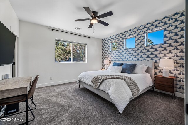 3580 Huron, Flagstaff, AZ 86005 - bedroom featuring carpet floors, an accent wall, a ceiling fan, baseboards, and visible vents