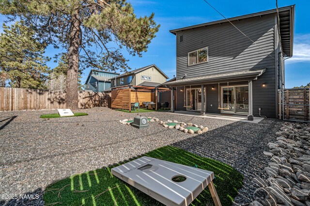 3580 Huron, Flagstaff, AZ 86005 - rear view of property featuring a patio and a fenced backyard