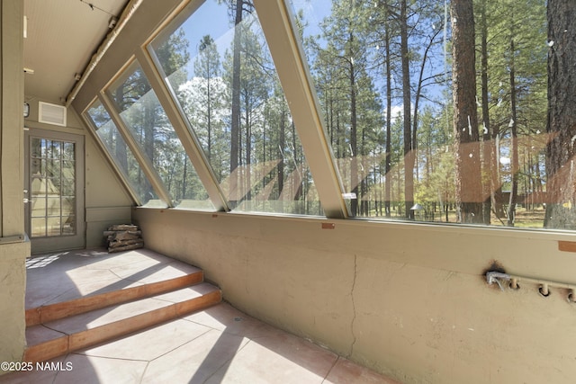 5241 E Mount Pleasant Dr, Flagstaff, AZ 86004 - unfurnished sunroom with tile patterned flooring