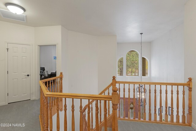 hallway with carpet floors